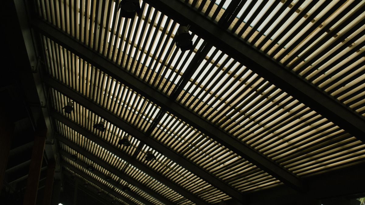 Linear LED light lines across a dark ceiling