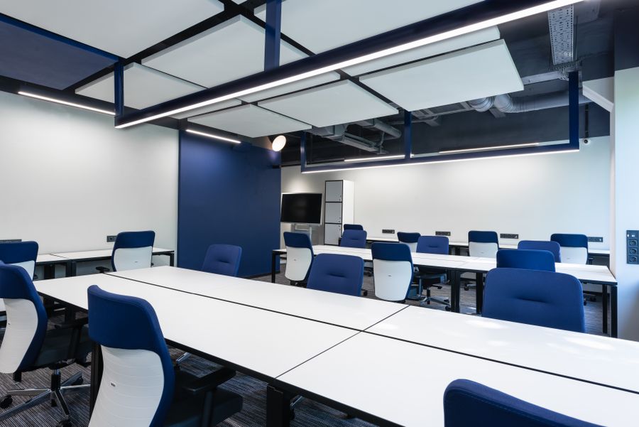 Commercial LED panel lit in an office ceiling